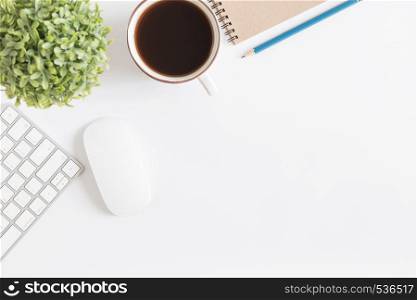 Flat lay photo of office desk with mouse and keyboard,White copyspace with pencil and tea,Top view