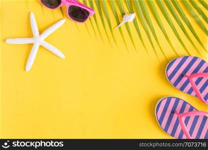 Flat lay photo saeshell and sandals on yellow background , top view and copy space for montage your product, summer concept
