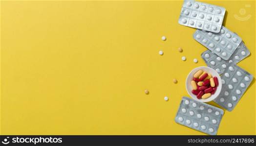 flat lay pills with foils copy space