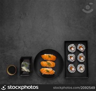 flat lay plates with maki nigiri sushi with copy space