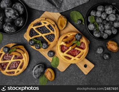flat lay sweet pies with fruits