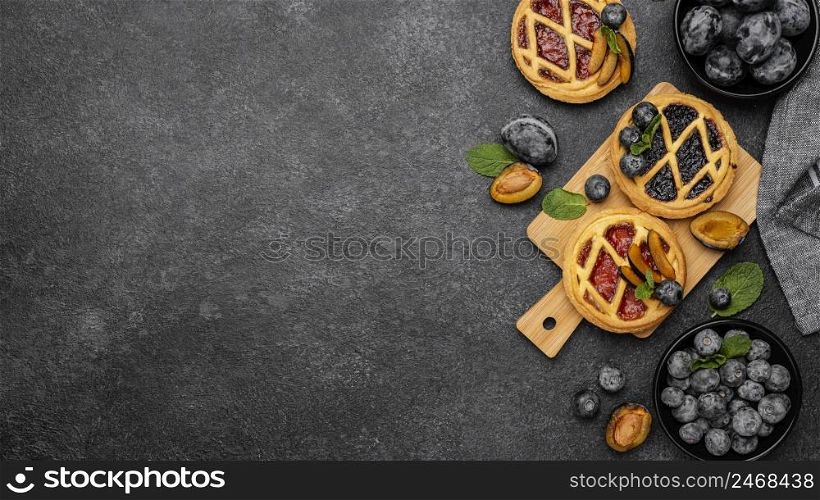 flat lay sweet pies with fruits copy space