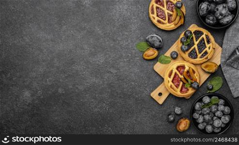 flat lay sweet pies with fruits copy space