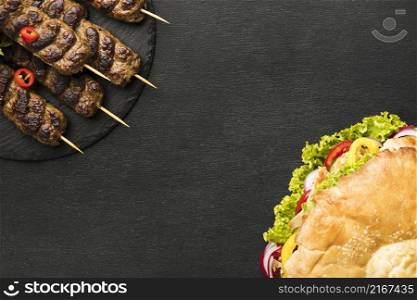 flat lay tasty kebab slate with copy space