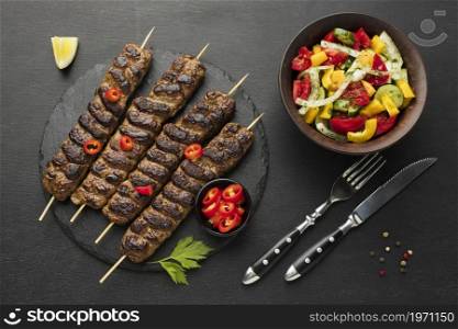 flat lay tasty kebab slate with other dish cutlery. High resolution photo. flat lay tasty kebab slate with other dish cutlery. High quality photo