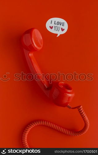 flat lay telephone receiver with cord chat bubbles
