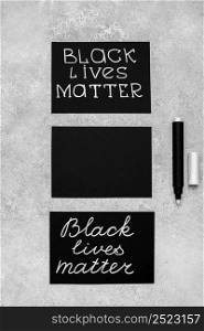 flat lay three cards with black lives matter pen