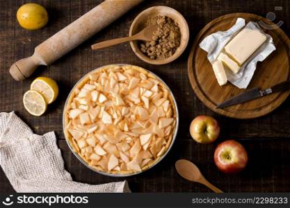 flat lay uncooked apple pie with cinnamon