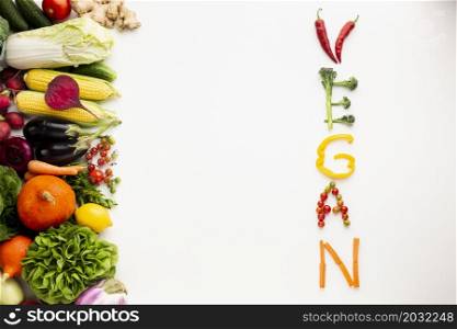 flat lay vegan lettering made out vegetables