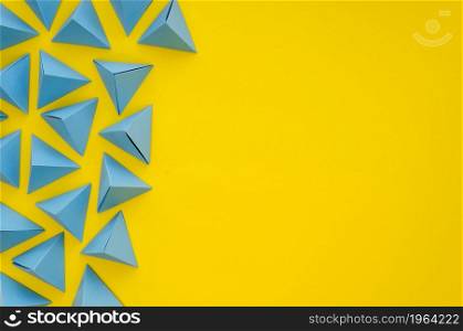 flat lay vibrant colored paper pyramids with copy space. High resolution photo. flat lay vibrant colored paper pyramids with copy space. High quality photo