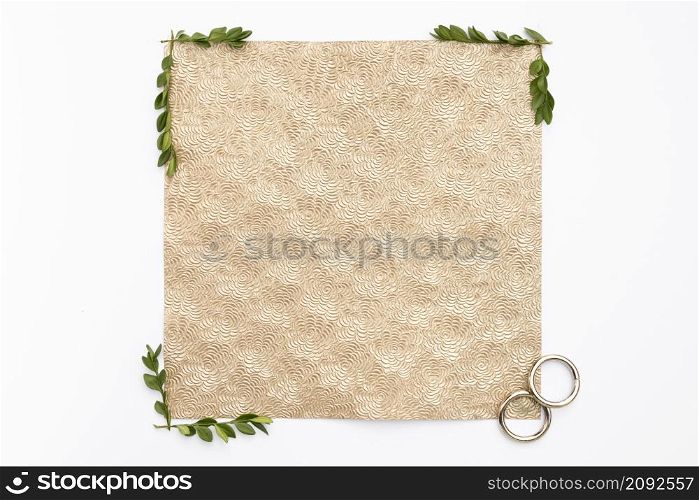 flat lay wedding rings with greeting card