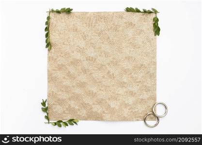flat lay wedding rings with greeting card