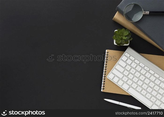flat lay work space with notebook keyboard