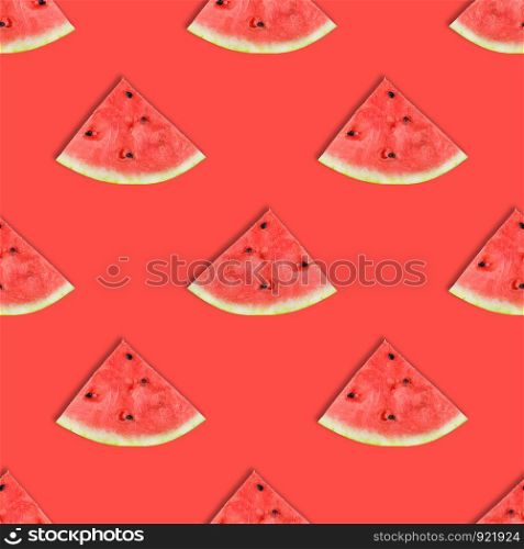 Flat layout of watermelon slices on pink or coral background. Watermelon seamless pattern. Summer fruit.. Flat layout of watermelon slices. Watermelon seamless pattern.