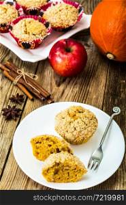 Flavored muffins with pumpkin and apple. Studio Photo. Flavored muffins with pumpkin and apple