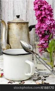 flavored tea,spoon for welding and blossoming lilac