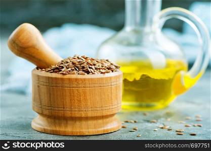 flax seed and oil in glass bottle