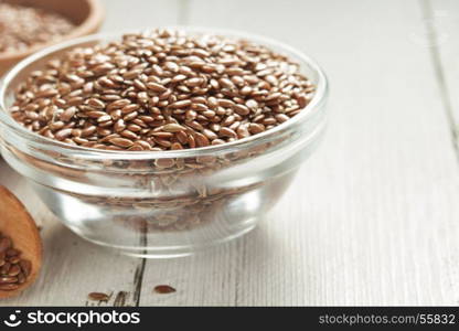 flax seeds in bowl on table background