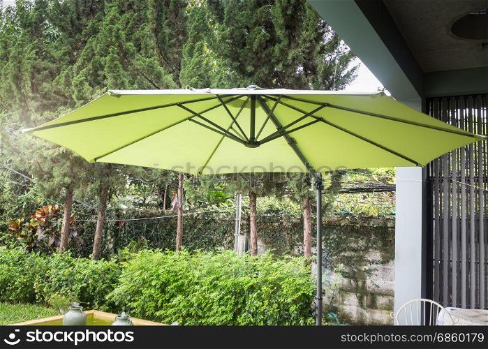 Flaxen garden umbrella in summer, stock photo