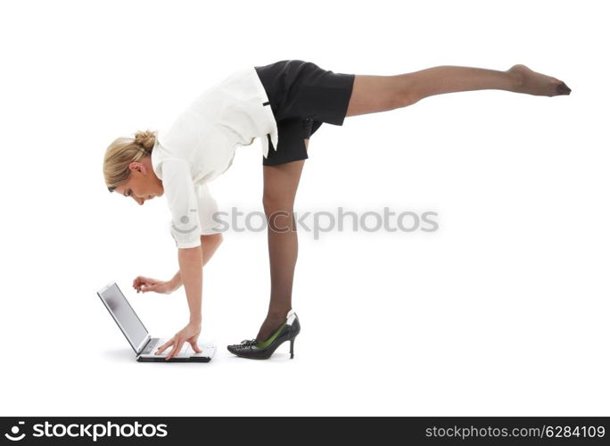 flexible businesswoman with laptop computer over white