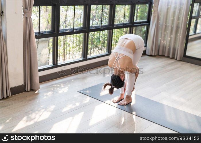 Flexible sport asian woman warming up Fitness woman doing stretch exercise stretching exercising Fitness healthy relaxation Home workout concept