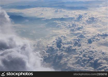 Flight above clouds. Panorama from window of plane with white clouds. Flying over white clouds. White clouds below. Beautiful panorama with heaven. Panorama from window of plane with white clouds