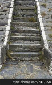 Flight of old stone steps in harbour wall.