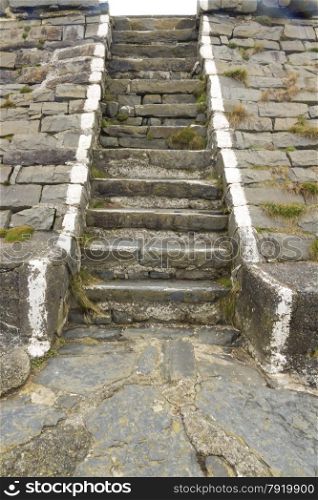 Flight of old stone steps in harbour wall.