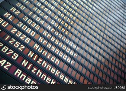 Flights information board in airport with copyspace