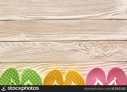 Flip flops over wooden background