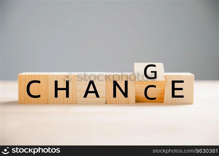 Flipping CHANGE to CHANCE on wooden block. turns cube, embodying personal development and career growth. Creative business concept on wood background. Seize the opportunity to transform your life.