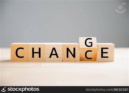 Flipping CHANGE to CHANCE on wooden block. turns cube, embodying personal development and career growth. Creative business concept on wood background. Seize the opportunity to transform your life.