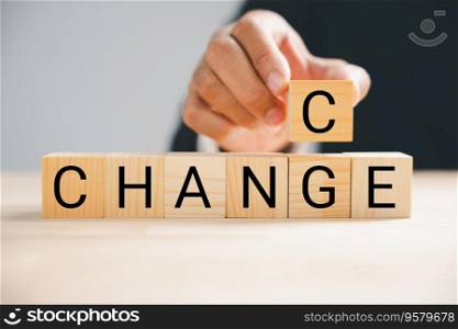 Flipping from CHANGE to CHANCE, businessman hand holds wood cube. Success, strategy, and opportunity concepts showcased. Vintage table setting enhances context. Change is.