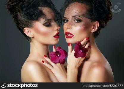Flirt. Portrait of Two Voluptuous Romantic Women with Violet Orchids