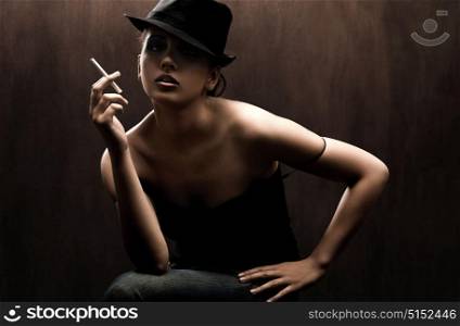 Flirty woman smoking the cigarette