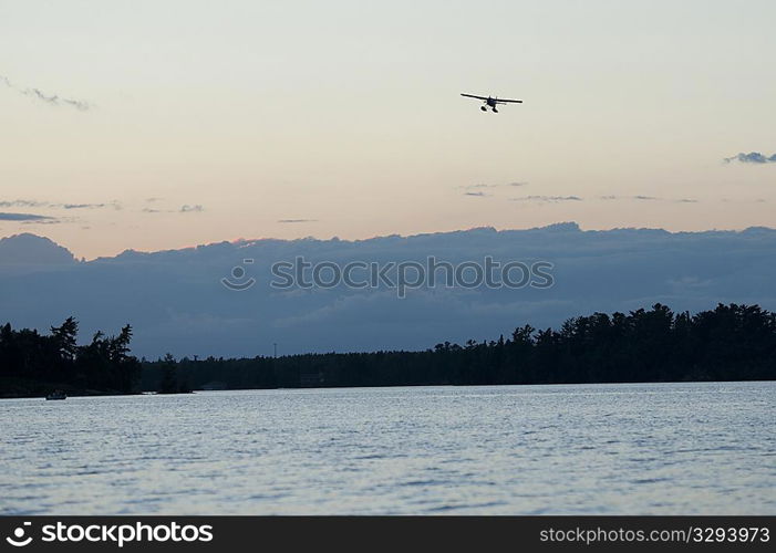 Float plane in the sky over Lake of the Woods, Ontario