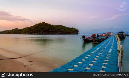 Floating bridge pier for tourist. Floating bridge pier for tourist on the beach in front of Ko Wua Ta Lap island view Ko Phi during sunset at Mu Ko Ang Thong National Marine Park in Gulf of Thailand, Surat Thani province,16:9 widescreen