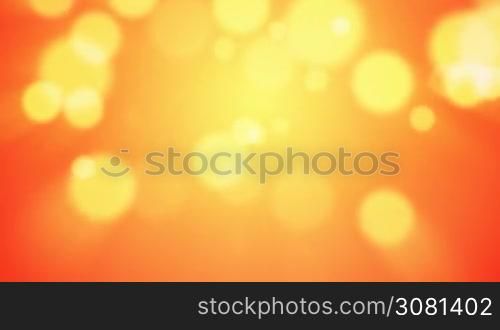 Floating defocused light particles on an orange background
