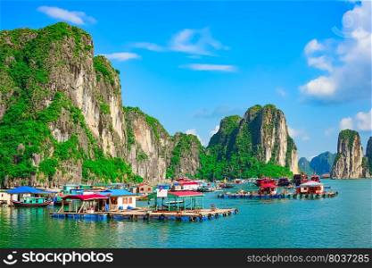 Floating fishing village and rock islands in Halong Bay, Vietnam, Southeast Asia. UNESCO World Heritage Site.