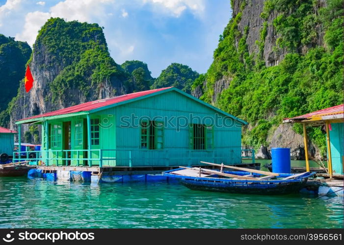 Floating fishing village near mountain islands in Halong Bay, Vietnam, Southeast Asia