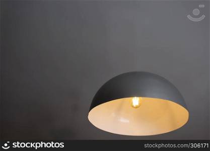Floating lamp illusion - innovation, science, curiousity and magic - impossible industrial design with gray background
