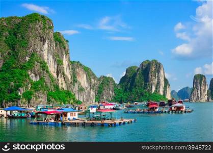 Floating village near rock islands in Halong Bay, Vietnam, Southeast Asia