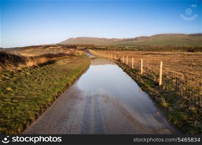 Flooded country lane farm landscape
