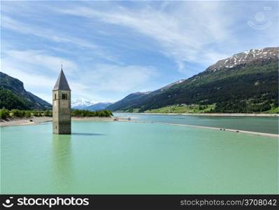 Flooded (in 1950) bell tower in Reschensee (Italy, church building in 14th-century)
