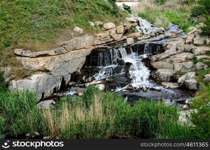 flooded industrial granite career with waterfalls