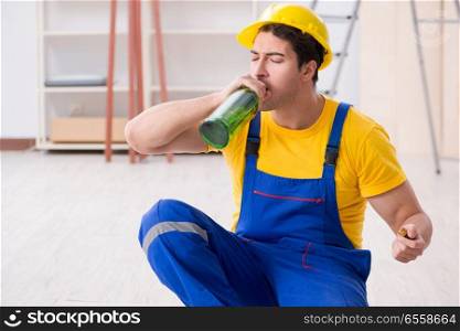 Floor repairman drinking alcohol during break