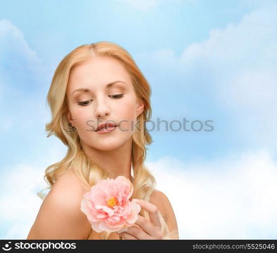 floral and beauty concept - lovely woman with peony flower