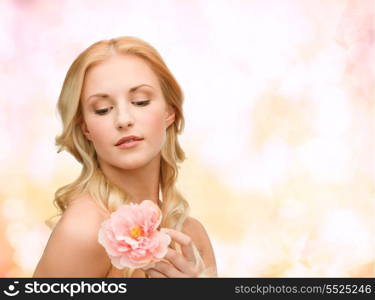 floral and beauty concept - lovely woman with peony flower