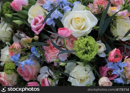 floral arrangement in pale pastel colors, pink, white and blue