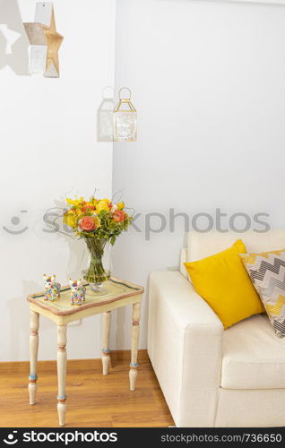 Floral arrangement of roses and carnations decorating the living room of the house
